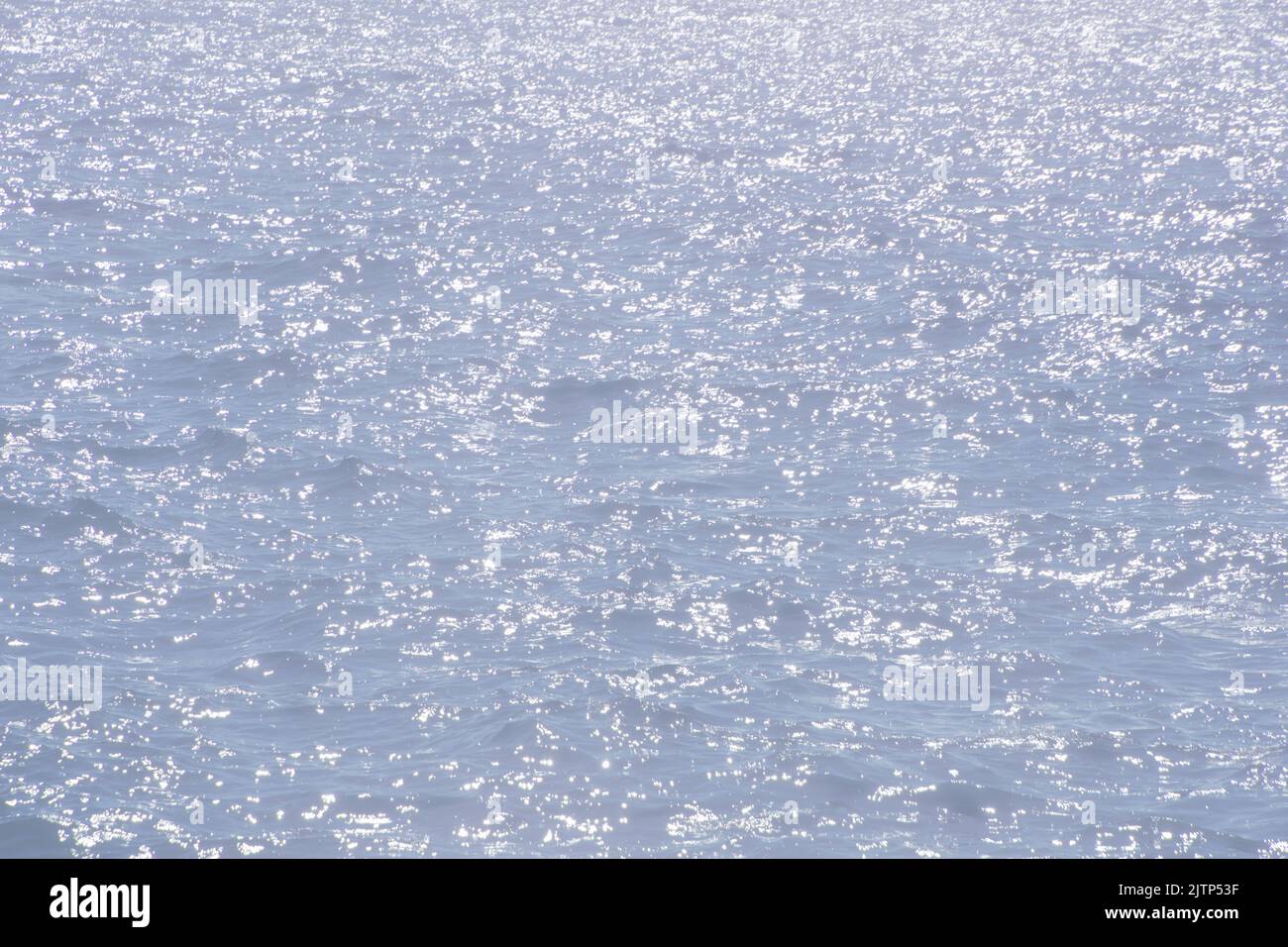reflective water surface with gentle ripples behind a white veil Stock Photo