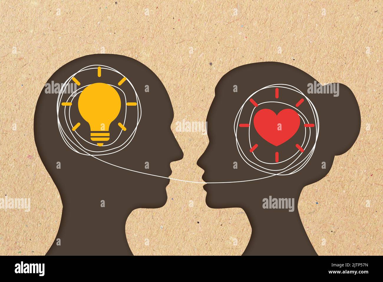 Man head silhouette with light bulb icon and woman head silhouette with heart icon - Concept of differences in communication between men and women Stock Photo