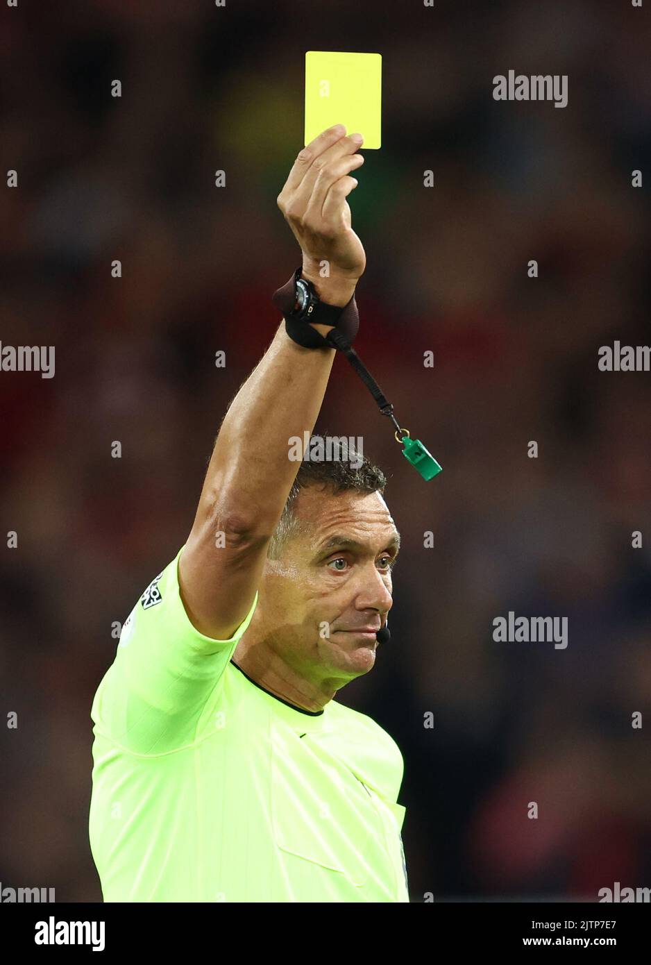 Liverpool, England, 31st August 2022.  Referee Andre Marriner shows a yellow card during the Premier League match at Anfield, Liverpool. Picture credit should read: Darren Staples / Sportimage Stock Photo