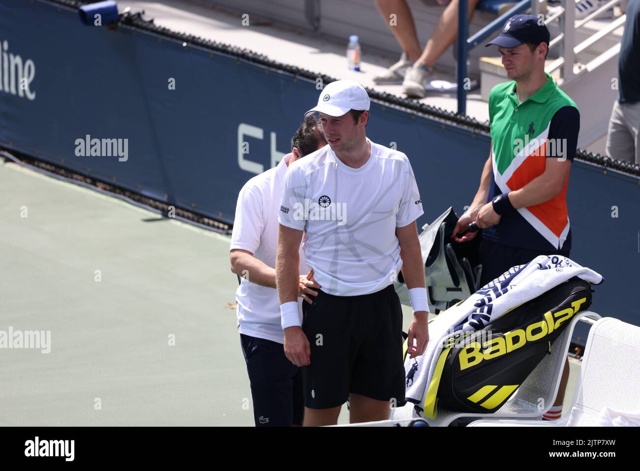NEW YORK, NY - AUGUST 31: Botic van de Zandschulp of the Netherlands consults with the trainer during his match against Corentin Moutet of France at USTA Billie Jean King National Tennis Center on August 31, 2022 in New York City. (Photo by Adam Stoltman/BSR Agency) Stock Photo