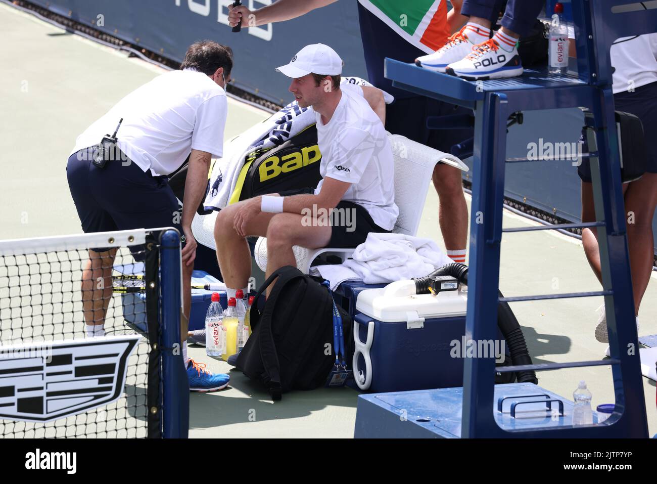 NEW YORK, NY - AUGUST 31: Botic van de Zandschulp of the Netherlands consults with the trainer during his match against Corentin Moutet of France at USTA Billie Jean King National Tennis Center on August 31, 2022 in New York City. (Photo by Adam Stoltman/BSR Agency) Stock Photo