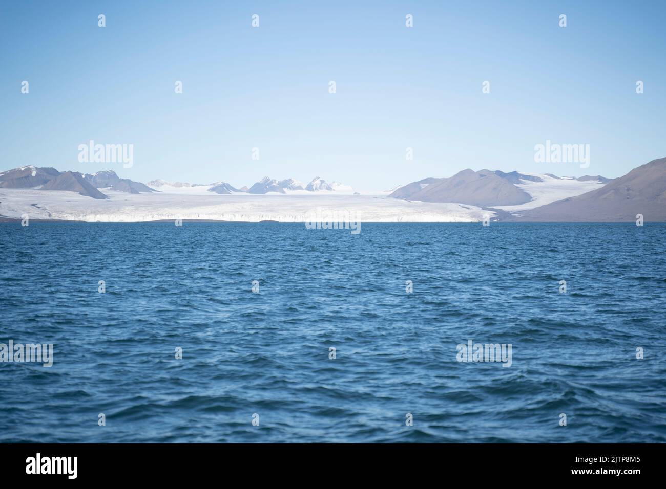 landscape view of an ice glacier in Svalbard islands, in the arctic sea  Stock Photo