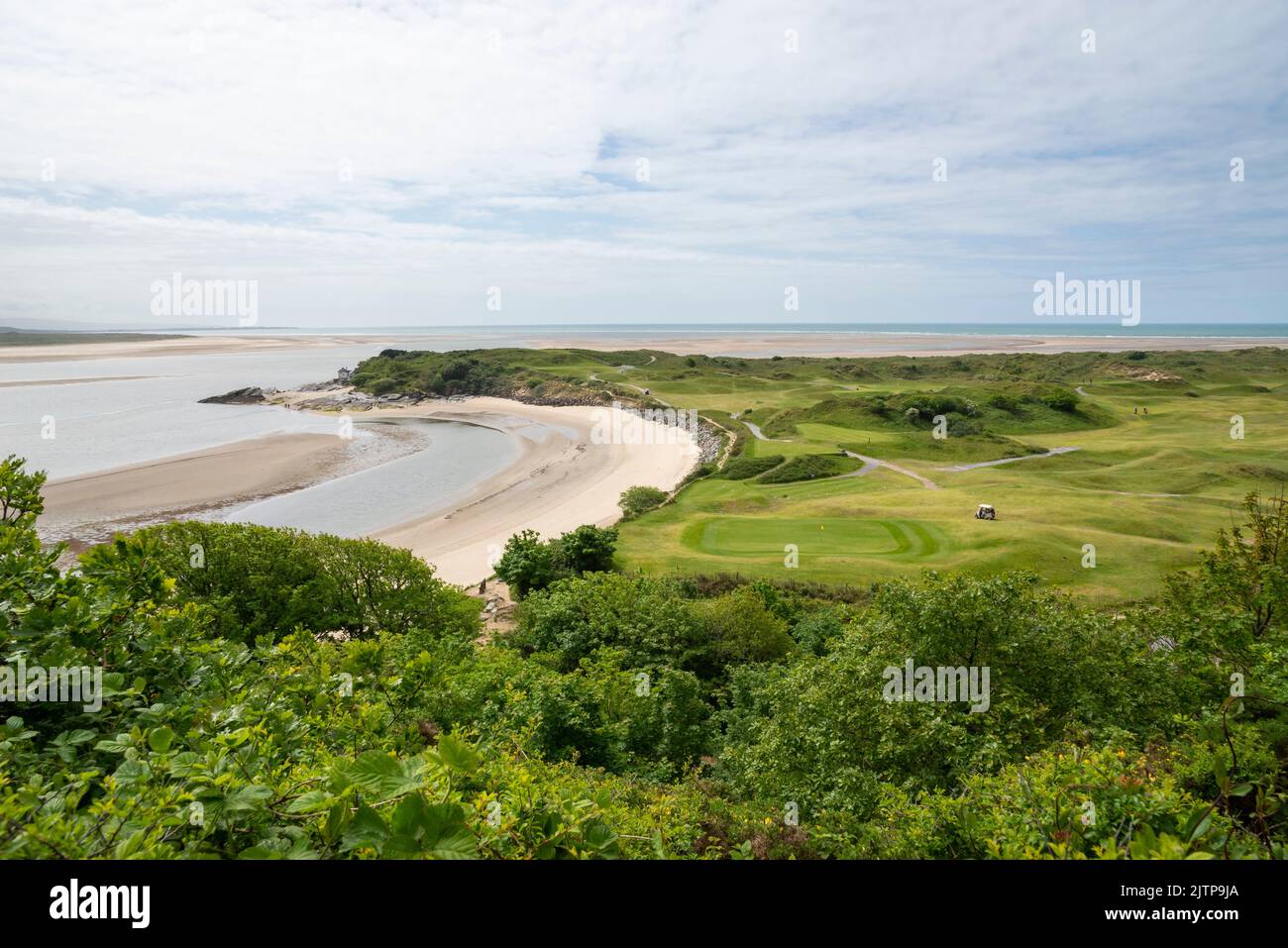 The beach and golf course at Ynys Cyngar near Morfa Bychan on the coast of North Wales. View looking out to Tremadog Bay. Stock Photo