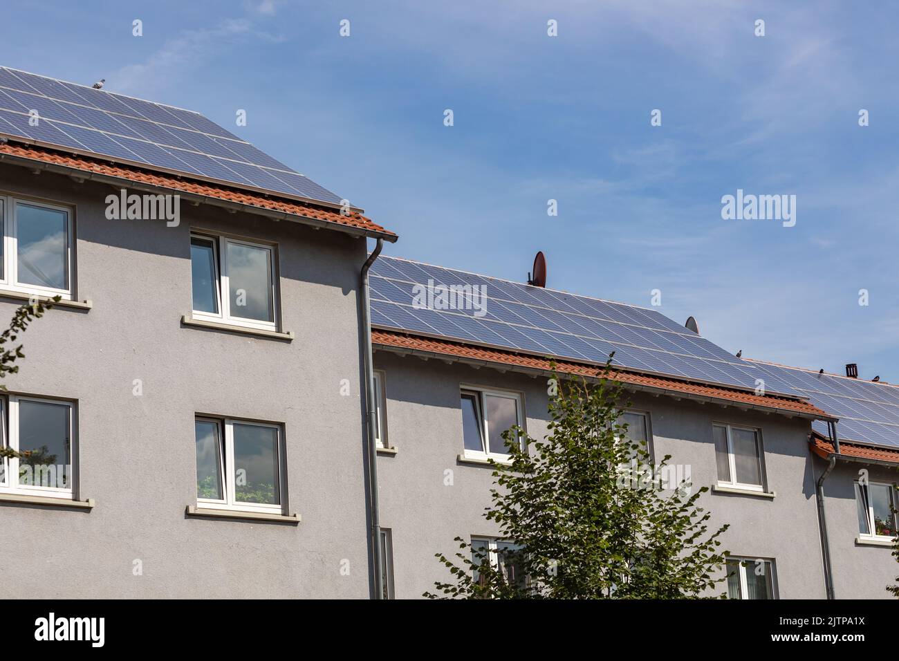 solar power plants on the roofs of apartment buildings Stock Photo