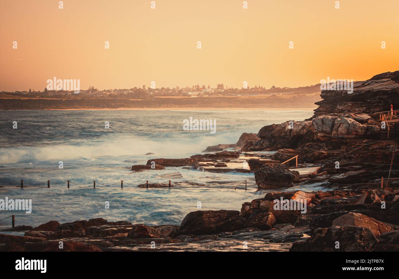 A beautiful dawn sky overlooking the ocean and Maroubra rock pool. Sydney, Australia Stock Photo