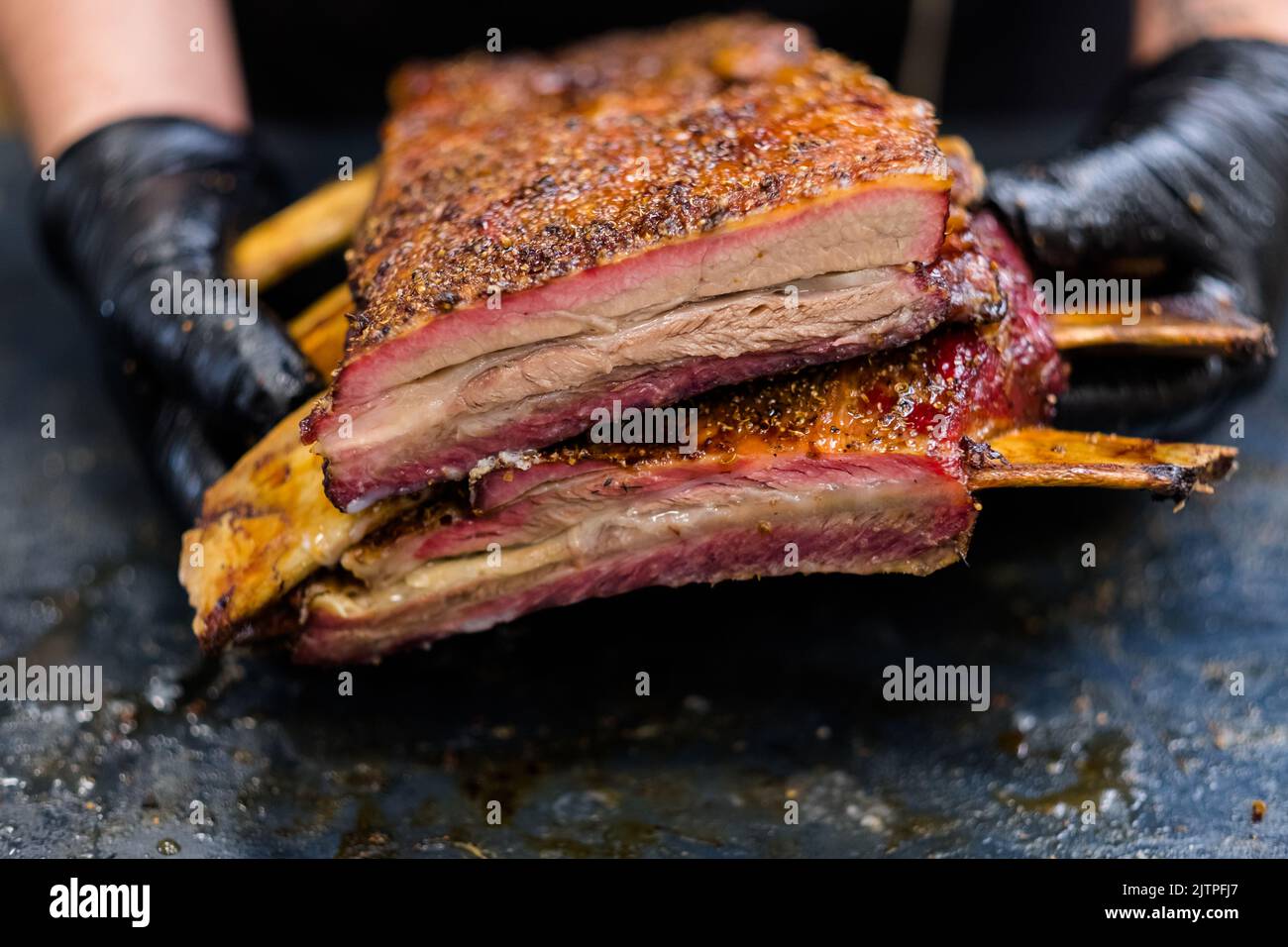 steakhouse menu grilled meat chef smoked beef ribs Stock Photo