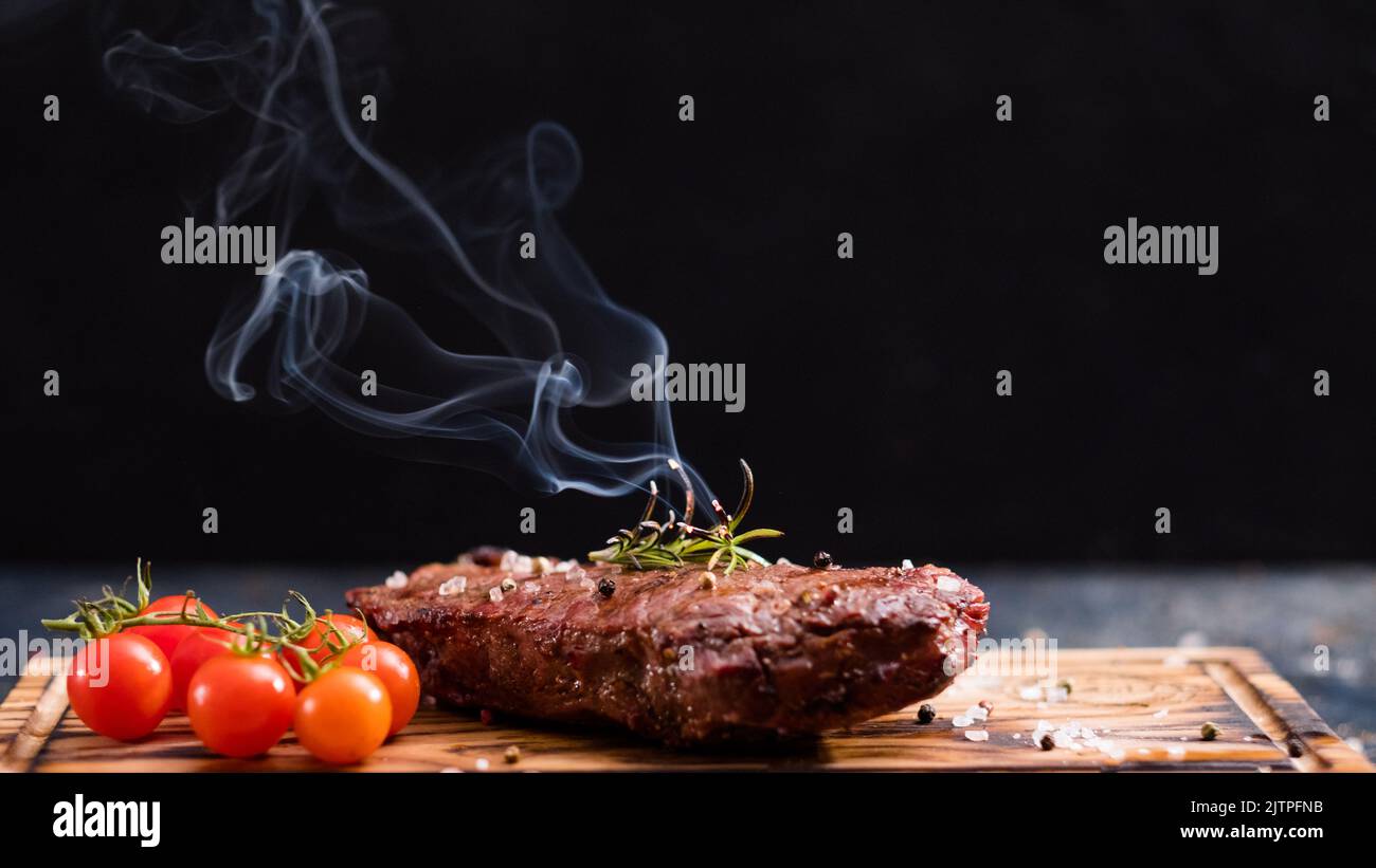steakhouse menu striploin steak beef meat rosemary Stock Photo Alamy