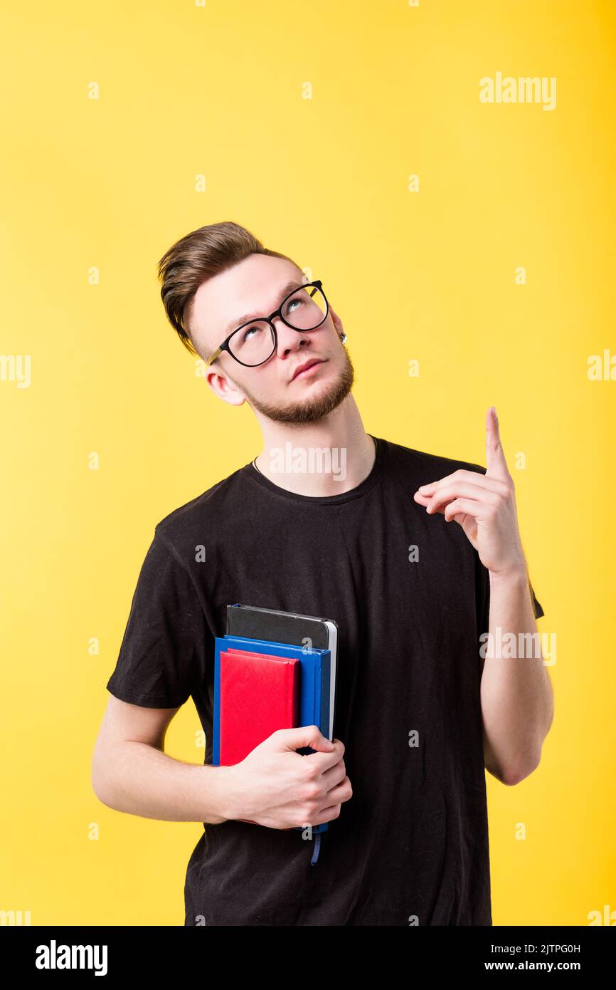 young man books pointing training class courses Stock Photo