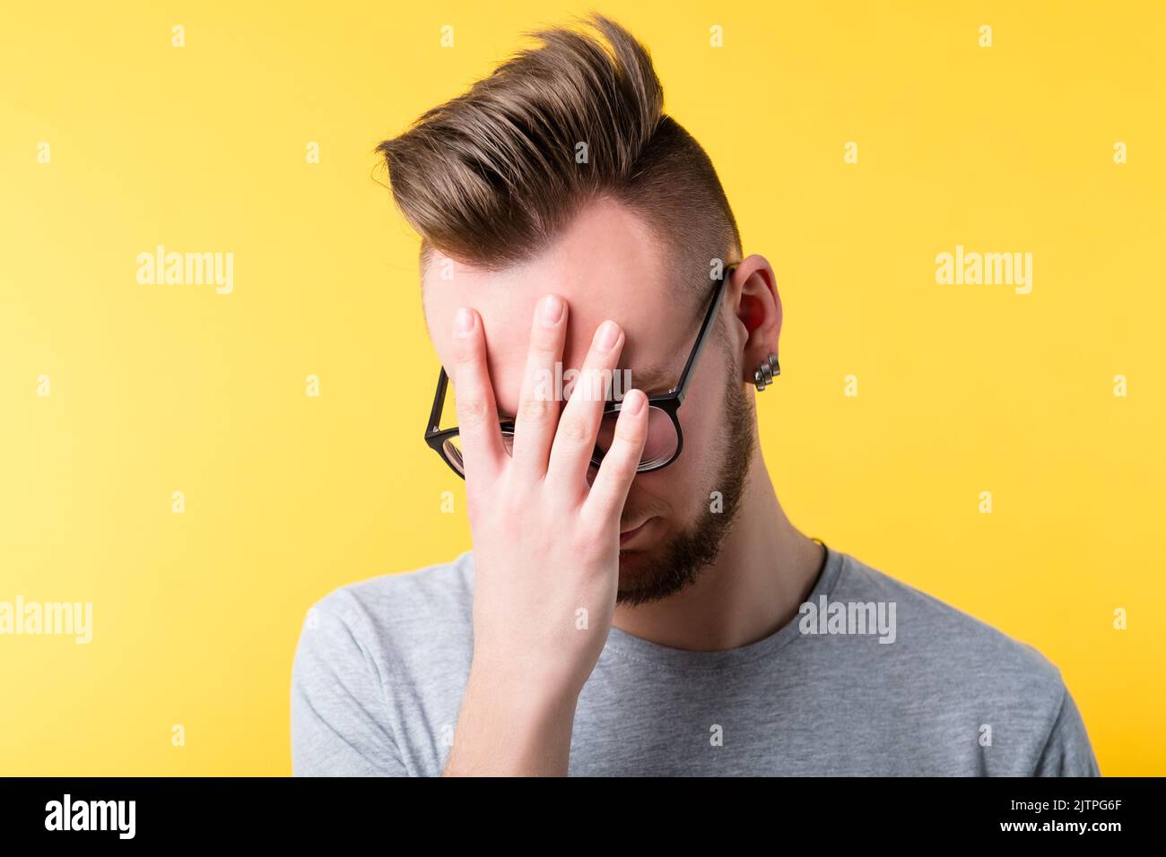 omg tired bored man face palm mistake Stock Photo