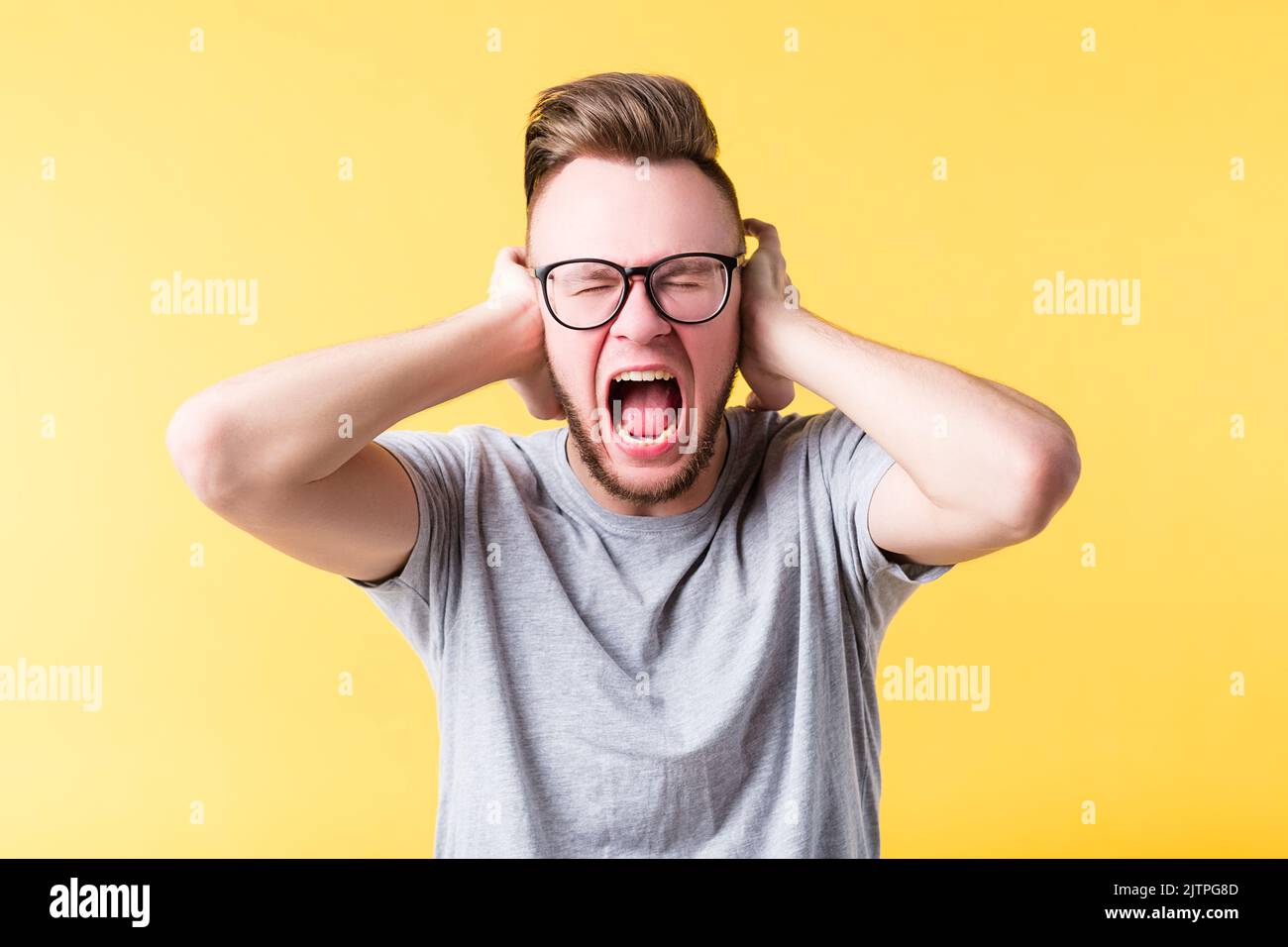 stress tension man yelling screaming emotion Stock Photo