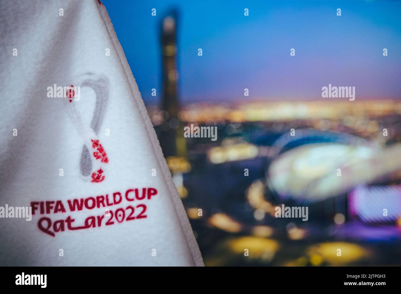 DOHA, QATAR, AUGUST 30, 2022: Khalifa International Stadium and official logo of FIFA World Cup 2022 in Qatar. Soccer wallpaper, white edit space. Off Stock Photo