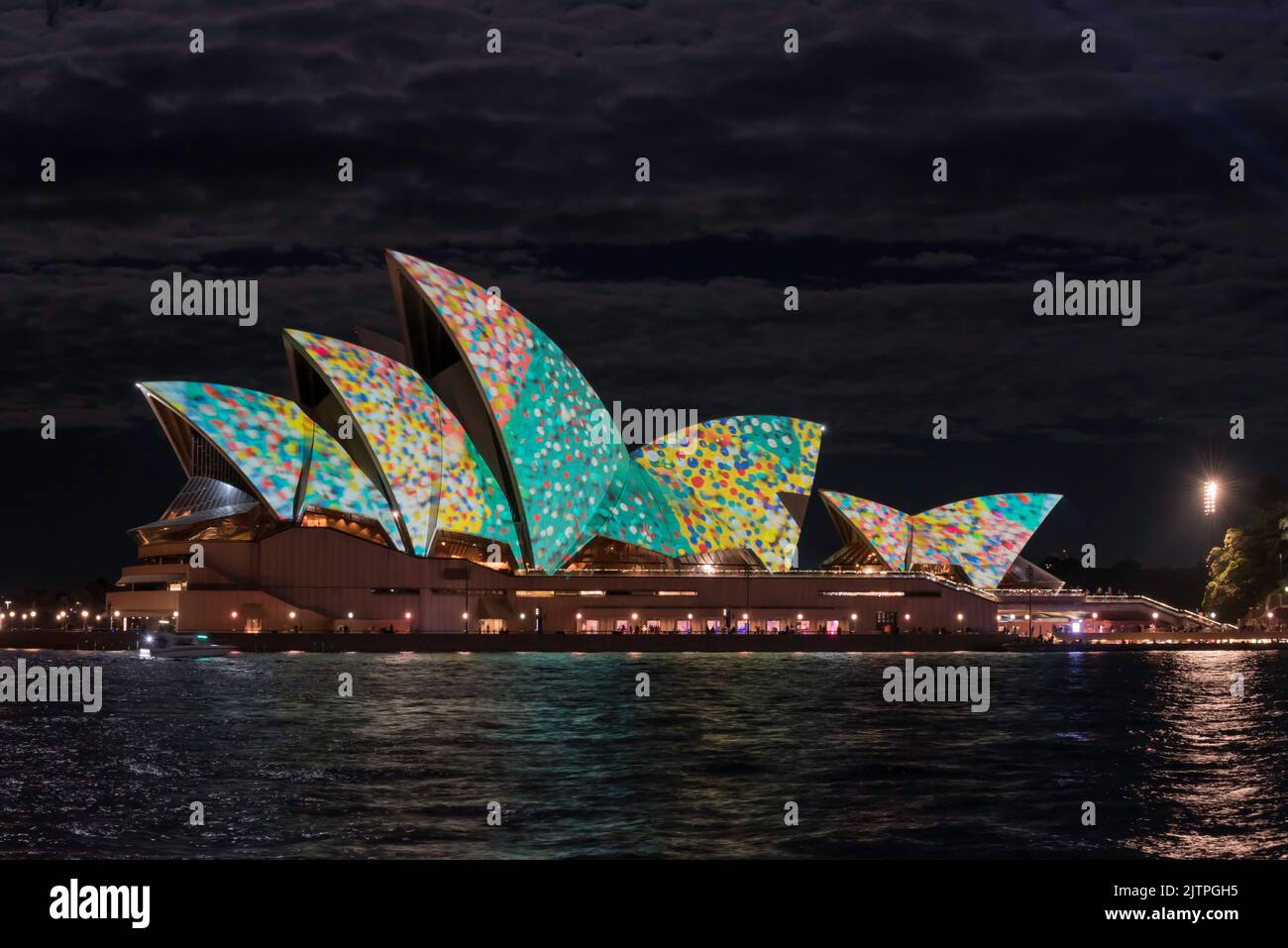 The Sydney Opera House and part of Circular Quay lit up with multicoloured projections at night during Vivid Sydney 2022 in Australia Stock Photo