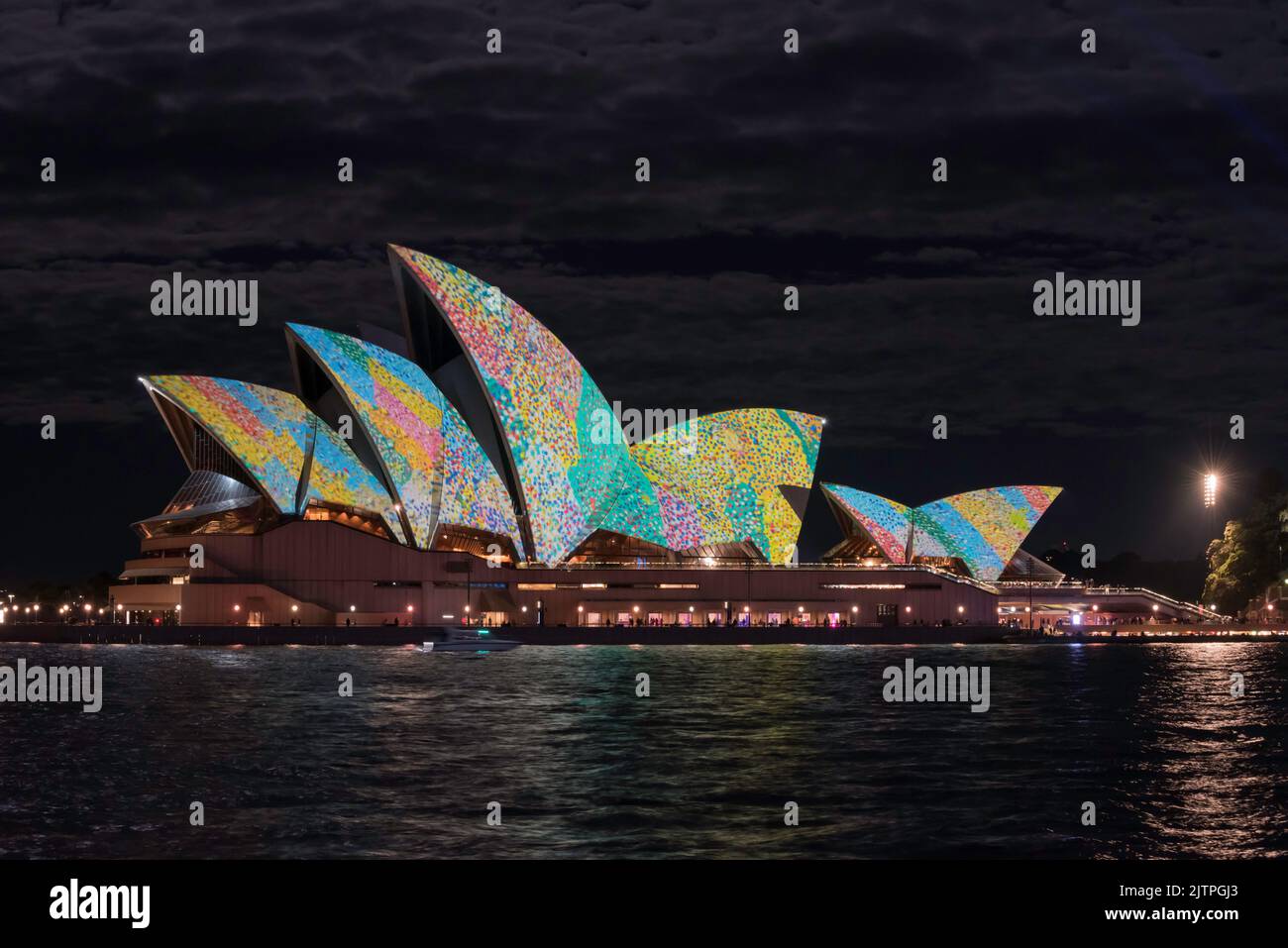 The Sydney Opera House and part of Circular Quay lit up with multicoloured projections at night during Vivid Sydney 2022 in Australia Stock Photo