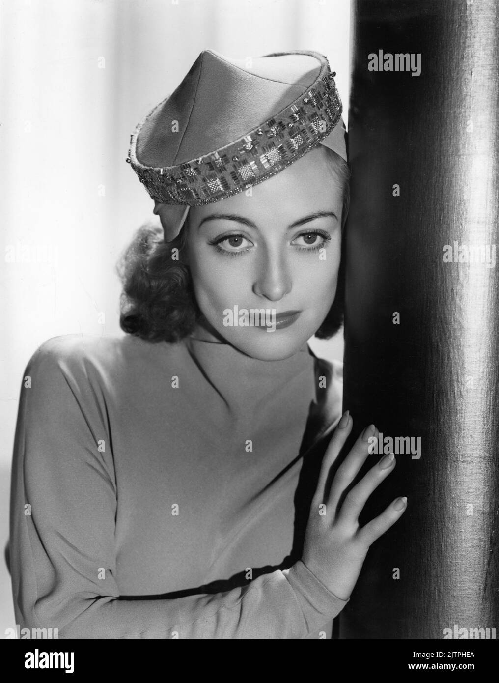 JOAN CRAWFORD Portrait by HURRELL in outfit by GILBERT ADRIAN