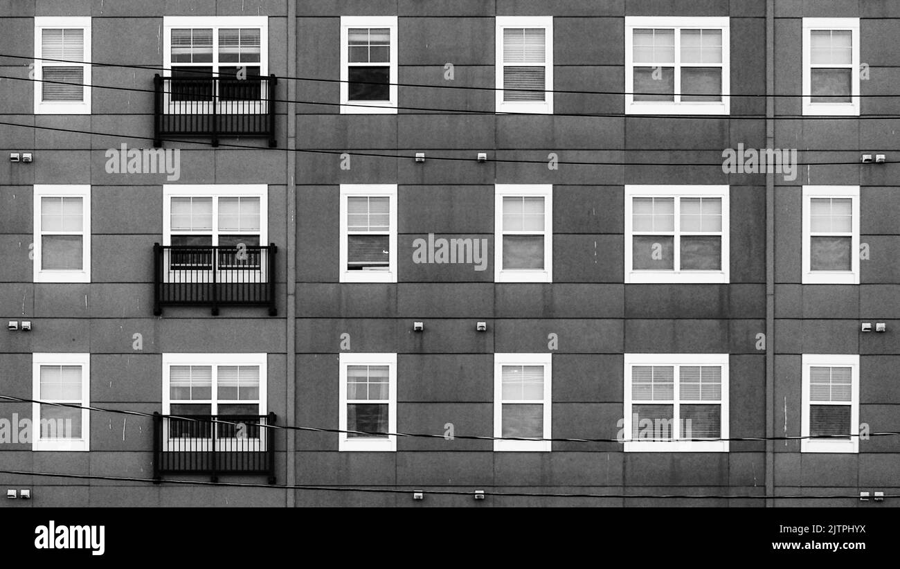 A greyscale shot of the apartment building Stock Photo