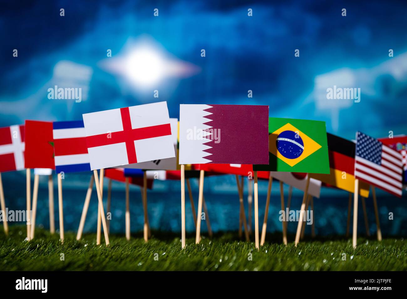 Football Wallpaper. Ball and national lags of top world soccer countries. Wallpaper for Tournament in Qatar Stock Photo