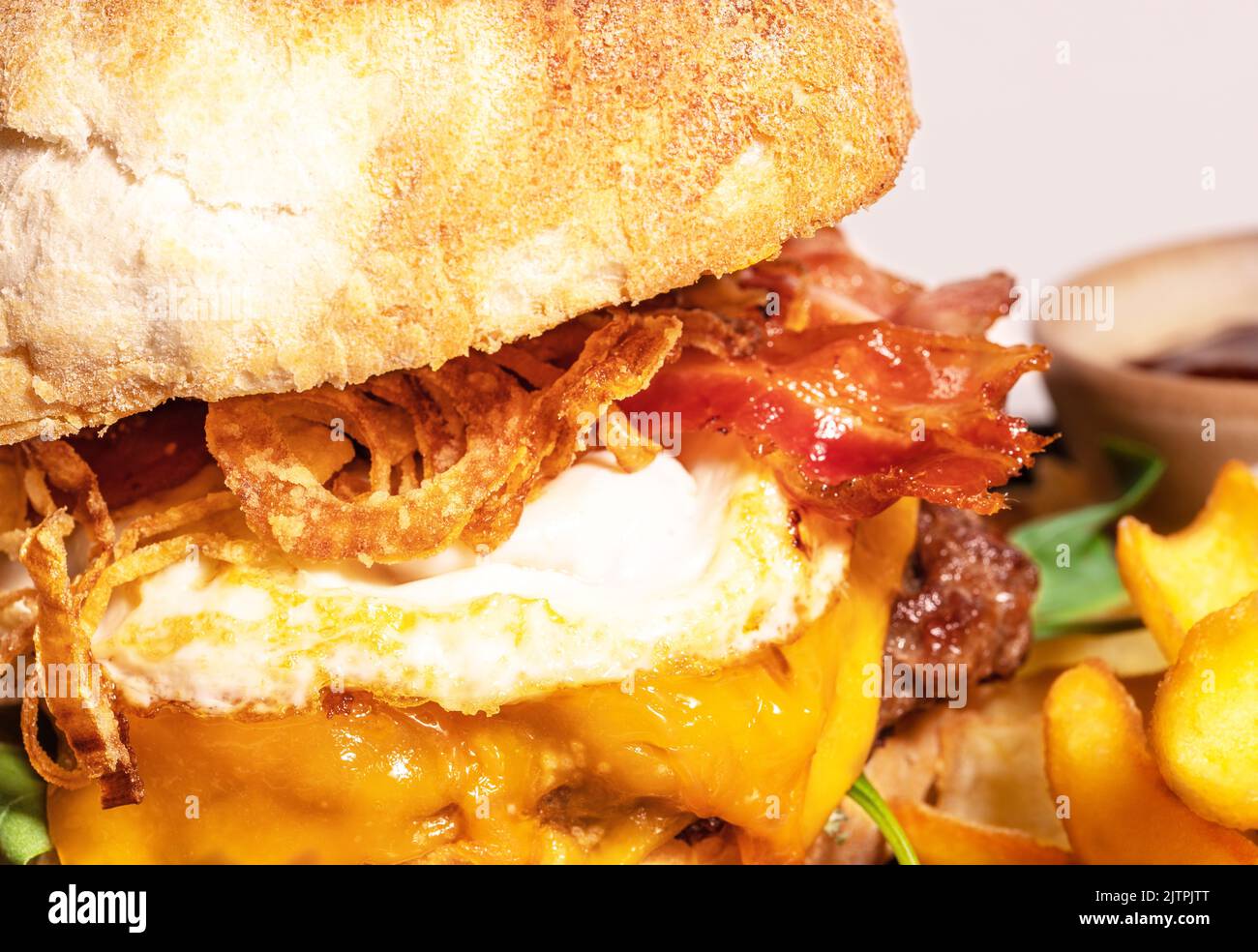 Homemade spicy hot cheeseburger with grilled beef, cheese and lettuce