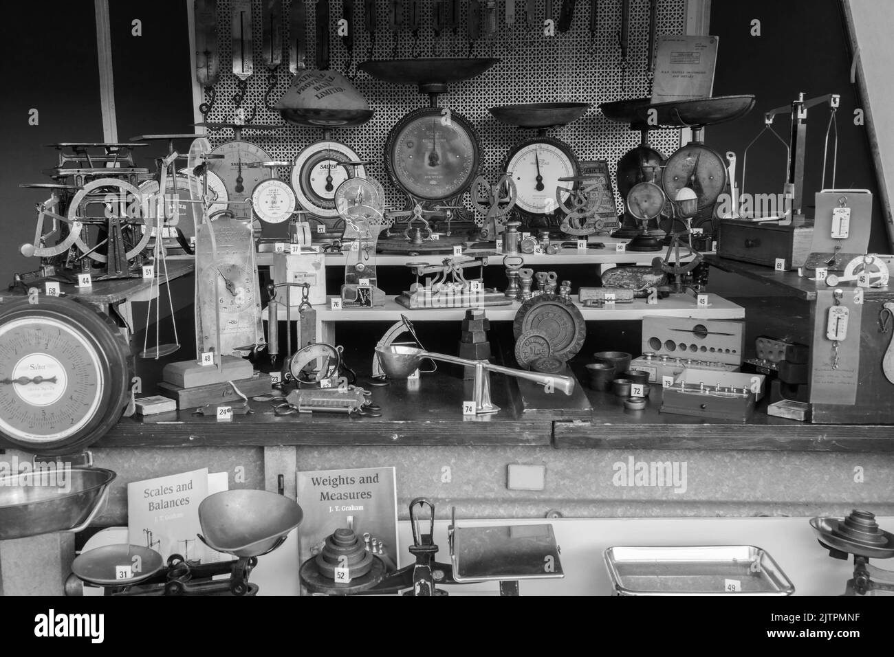 A collection of Weights and Measuring devices on display at Kington Vintage Show, Herefordshire England UK. August 2022 Stock Photo