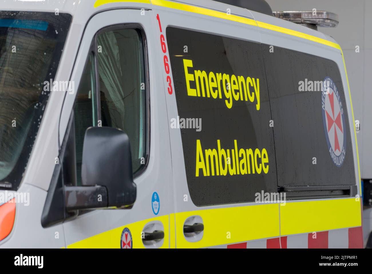 A close up of a New South Wales Emergency Ambulance van side on in Australia Stock Photo