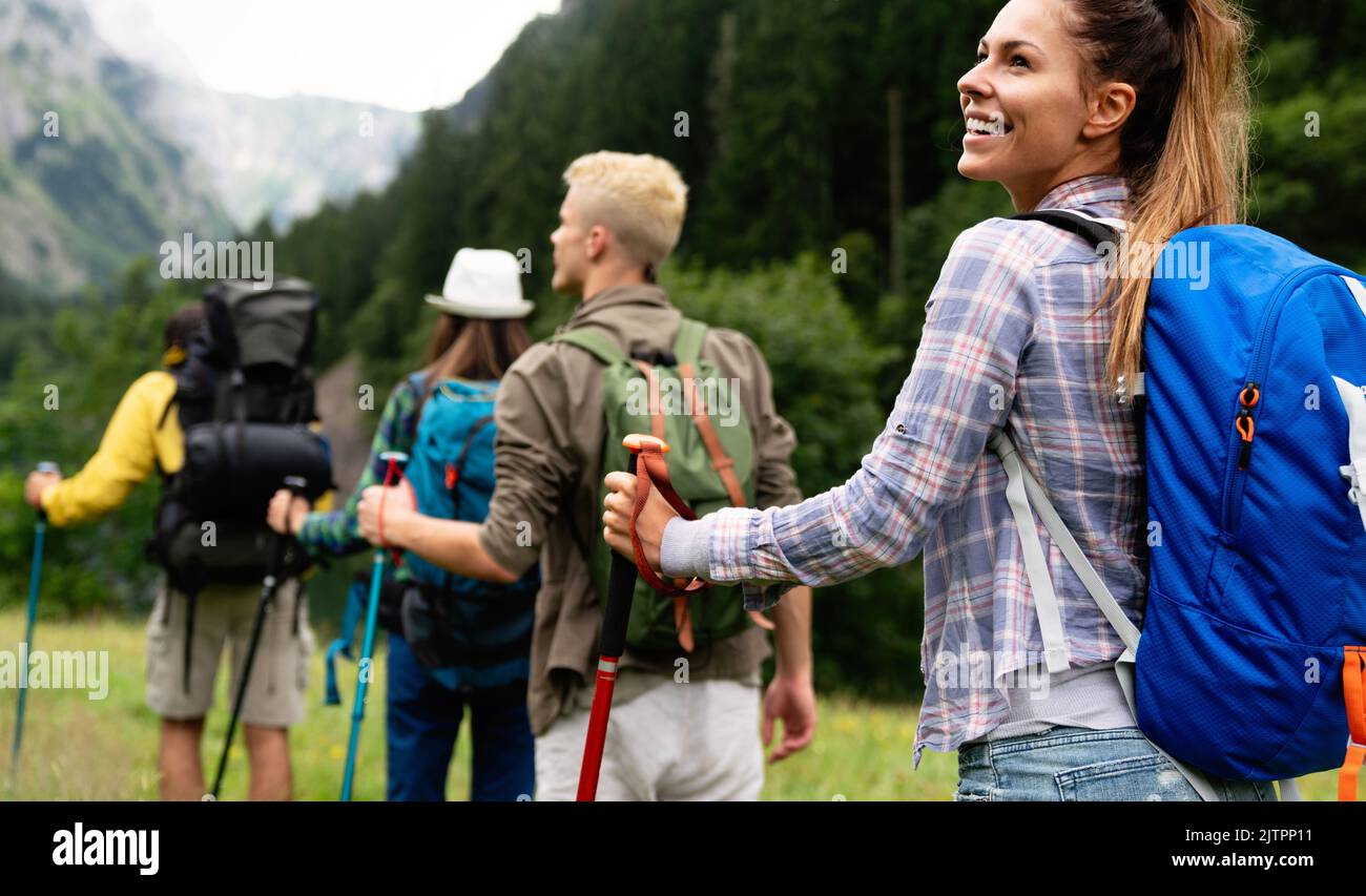 Group of happy hiker friends trekking as part of healthy lifestyle