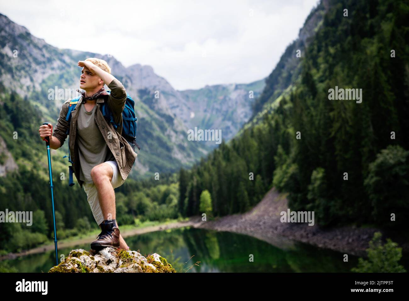 Happy Hiker Winning Reaching Life Goal, Success, Freedom And Happiness,  Achievement In Mountains. Thumbs-up. Hiker With Backpack On Top Of A  Mountain.Concept Of Success Stock Photo, Picture and Royalty Free Image.  Image