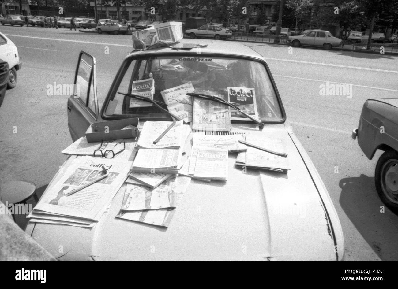 Bucharest, Romania, cca. 1991. Seller of magazines, using his vehicle ...