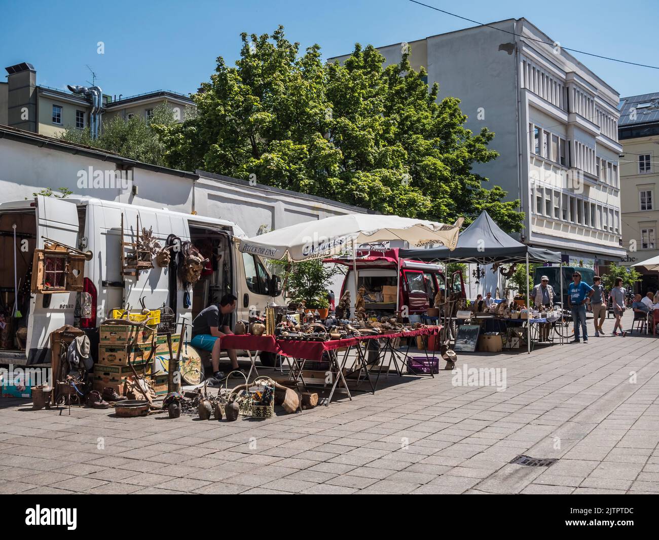 This street scene image is of the flea market antique fair held every Saturday in the old medieval city of Innsbruck, provincial capital city of Tirol Stock Photo