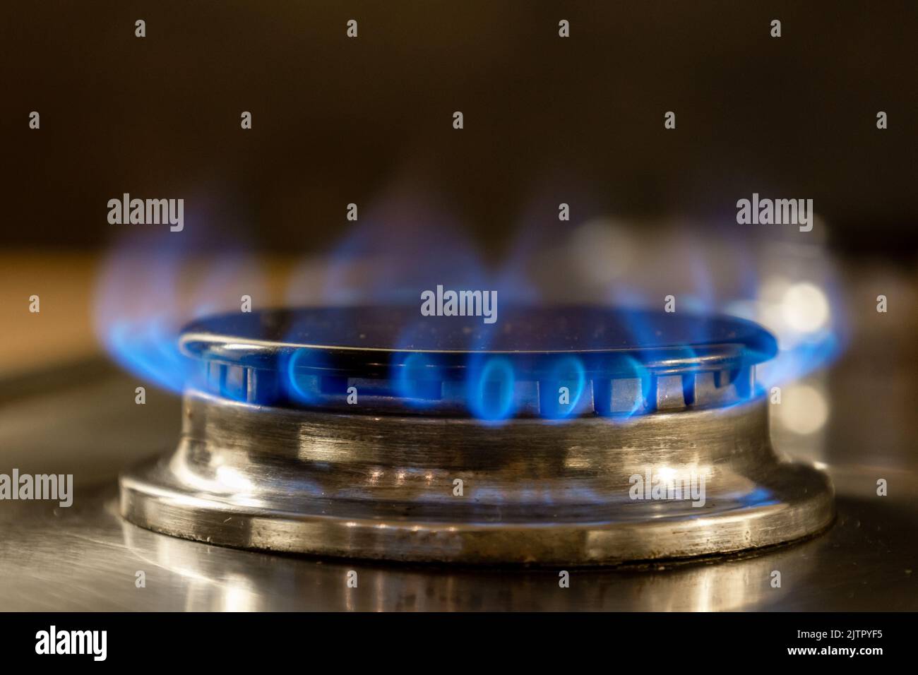 Burning natural gas on a gas stove is a clean fossil fuel that causes