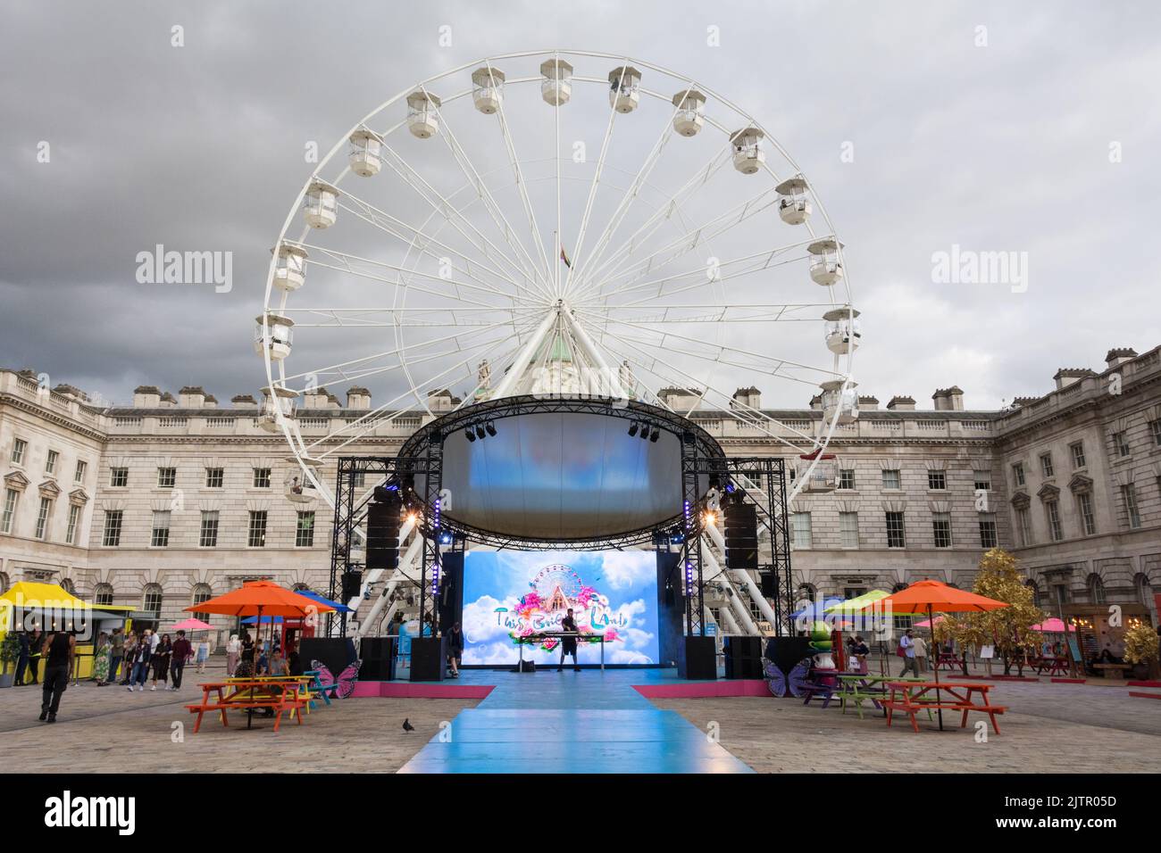 The stage and Ferris Wheel at the This Bright Land performance in the neoclassical Somerset House Courtyard, London, England, UK Stock Photo