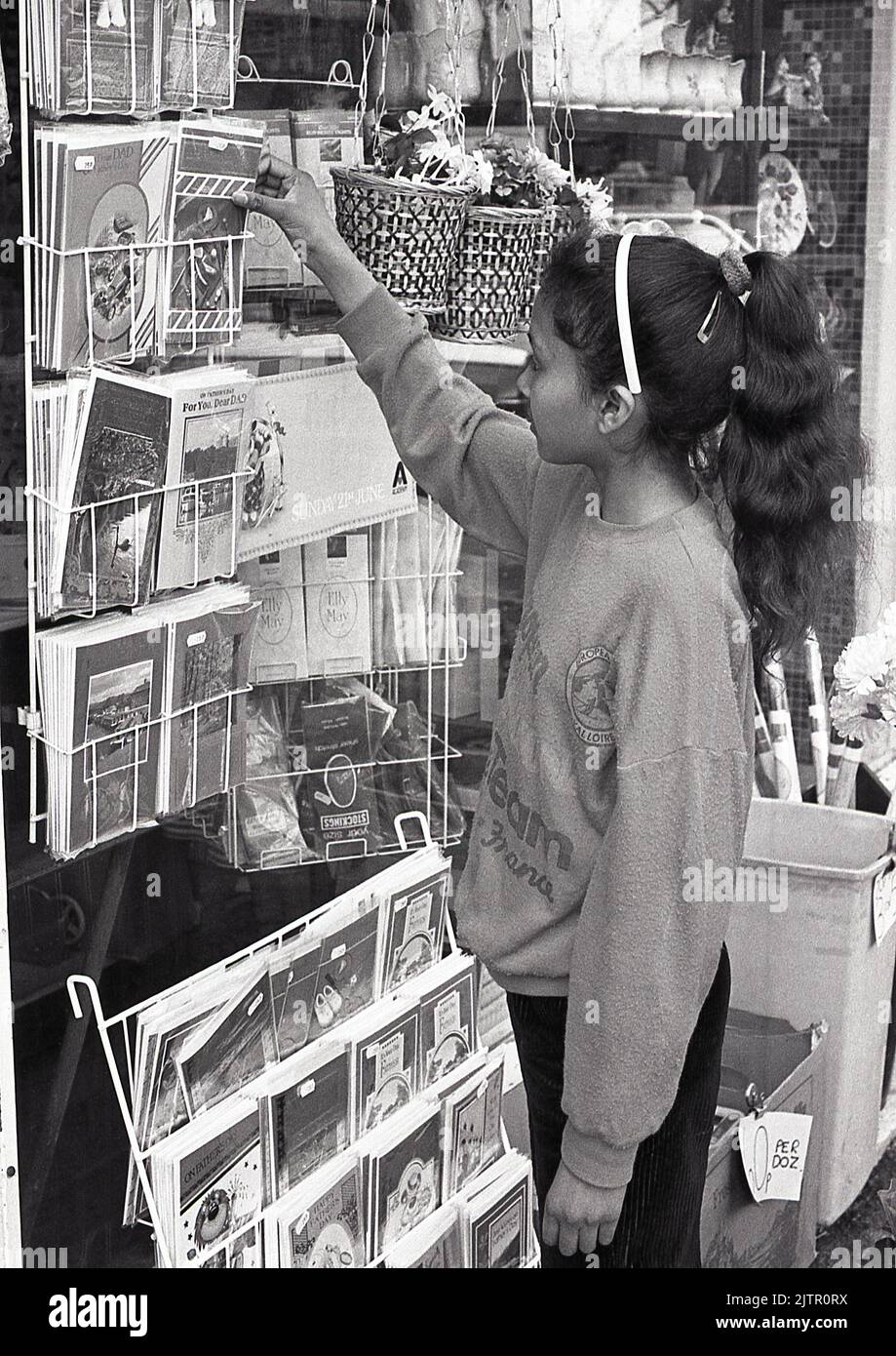 Girl buying greeting card, UK, 1987 Stock Photo - Alamy