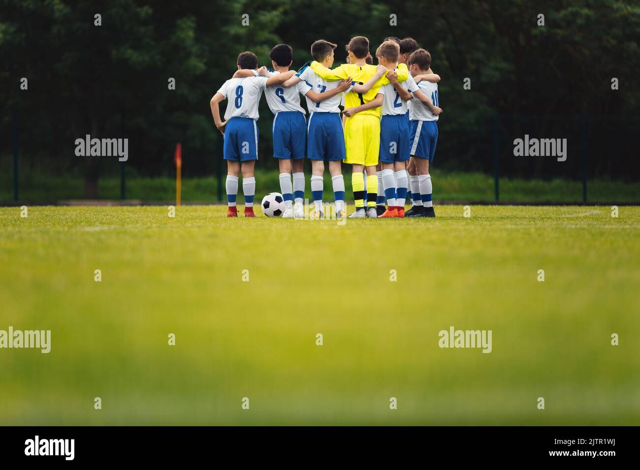 Happy kids playing sports. Youth team celebrating a victory in the