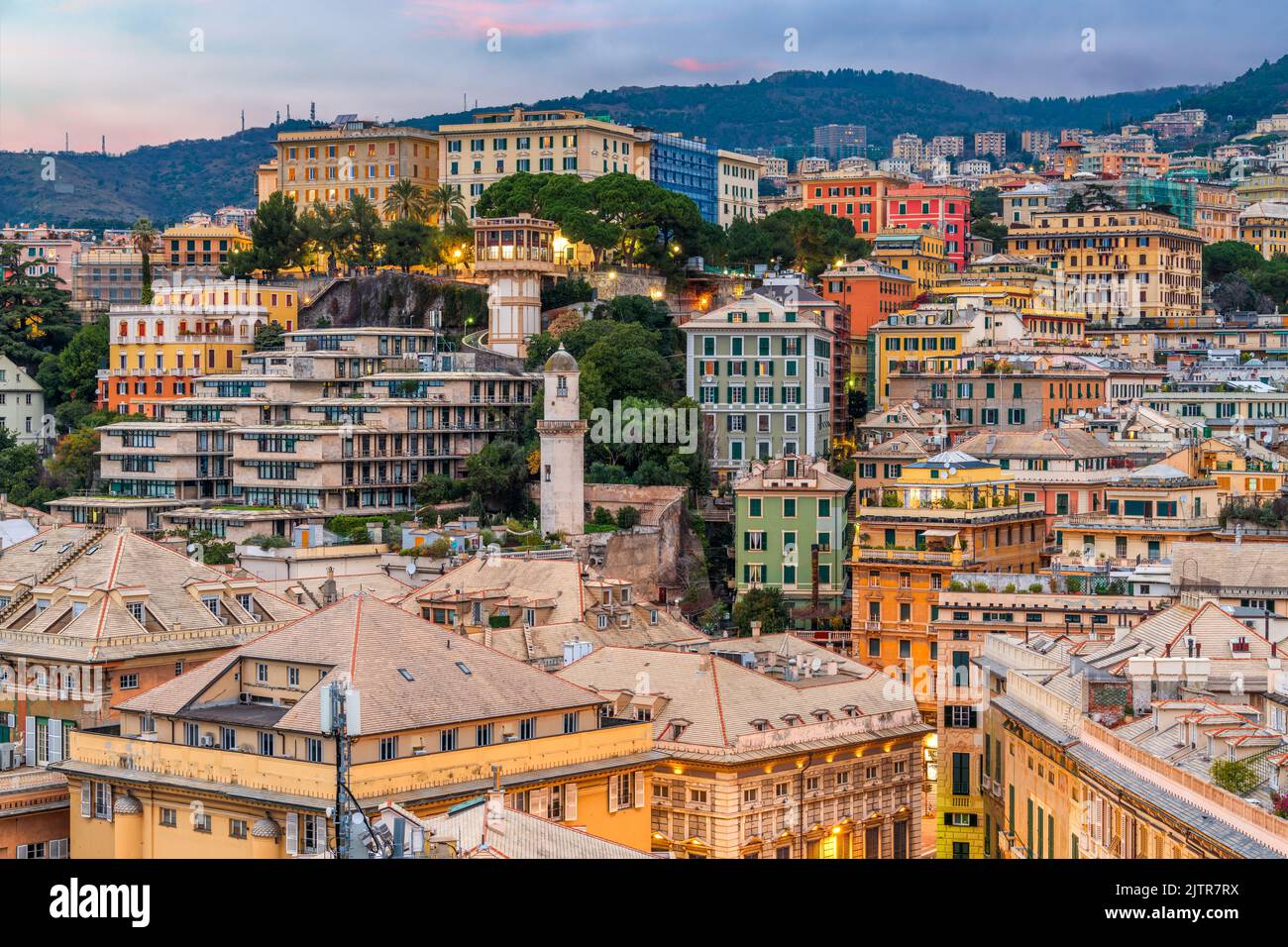 Genova, Italy city skyline view towards the historic belvedere castelletto at twilight. Stock Photo