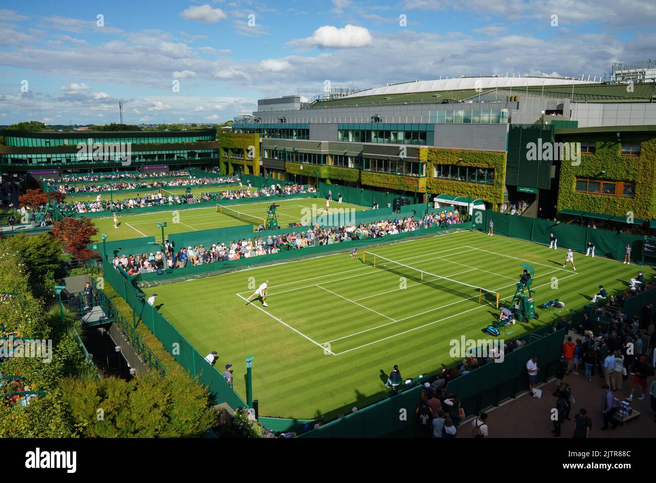 General Views of Court 14 with Adrian Mannarino and Max Purcell at The Championships 2022. Held at The All England Lawn Tennis Club, Wimbledon. Stock Photo