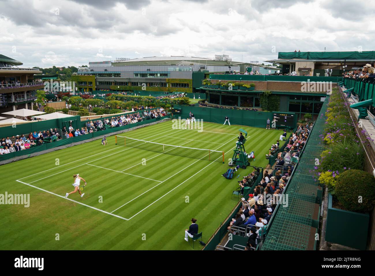 Katie Swan and Clara Burel on Court 18 at The Championships 2022. Held at The All England Lawn Tennis Club, Wimbledon. Day 2 Tuesday 28/06/2022. Stock Photo
