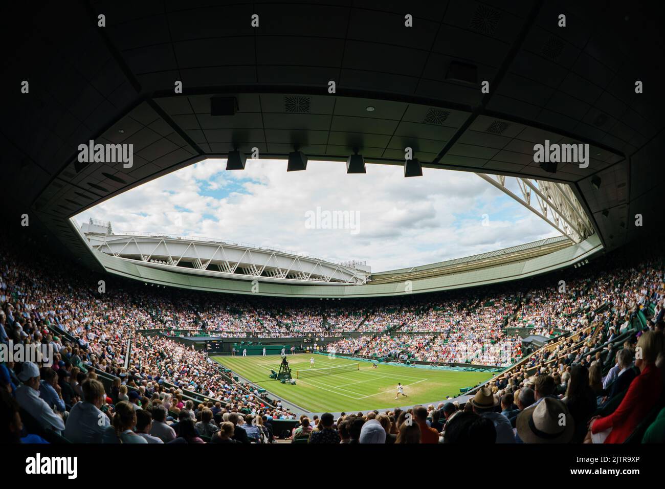 Jannik Sinner of Italy & Carlos Alcaraz of Spain on Centre Court during the Men’s Fourth Round Match at Wimbledon Championships 2022 Stock Photo