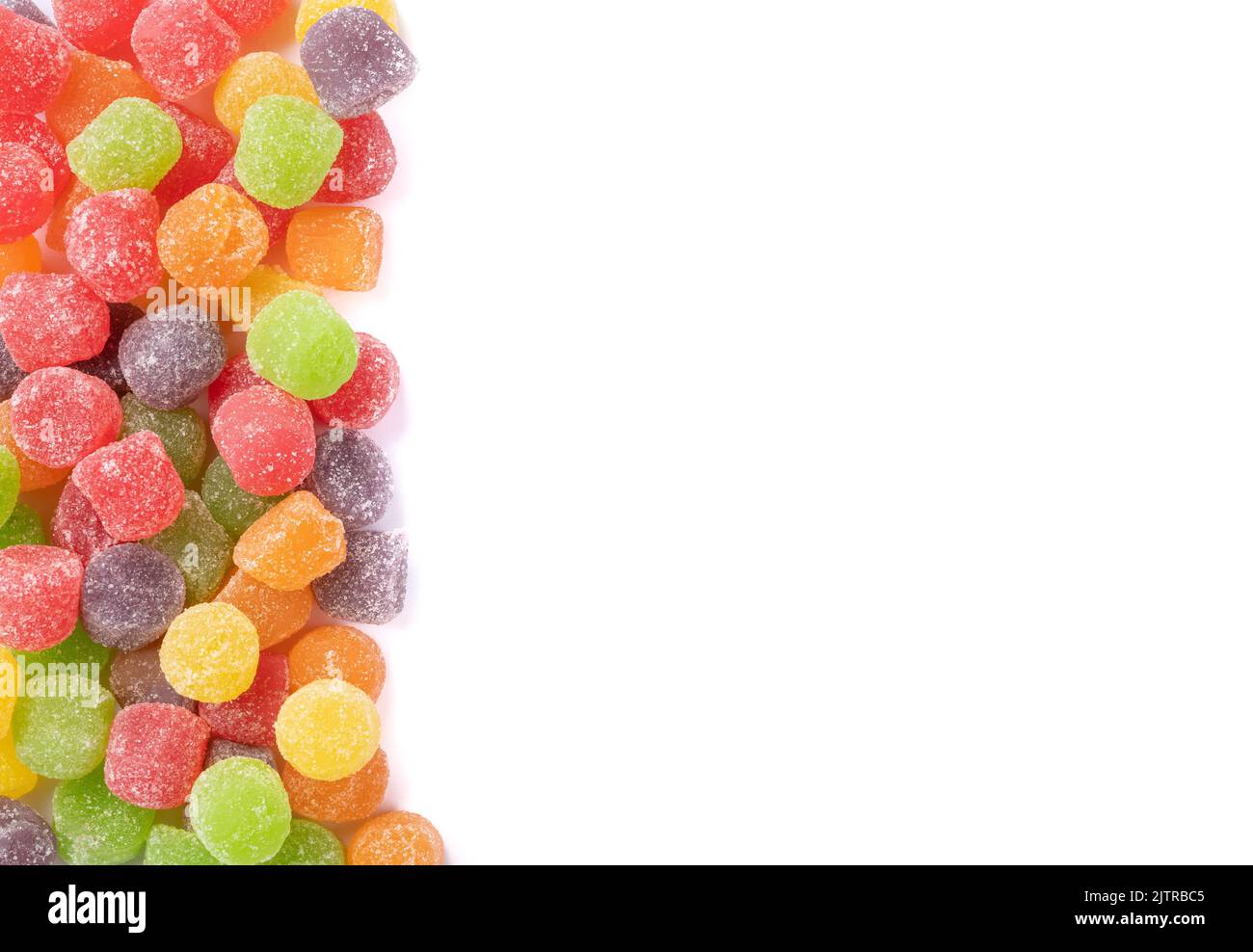 Colorful gum drop candies over white background with copy space Stock