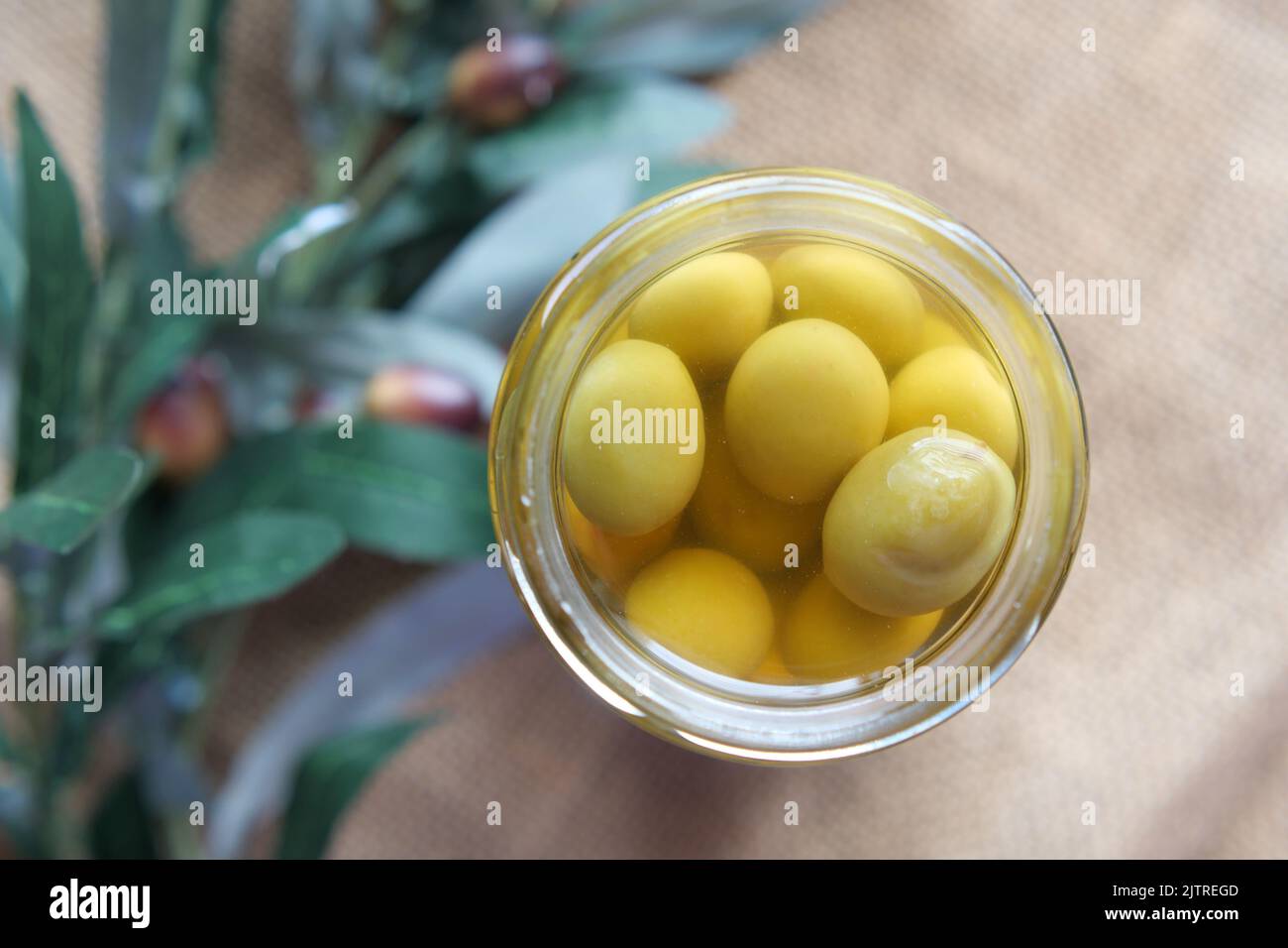 fresh olive in a container on table . Stock Photo