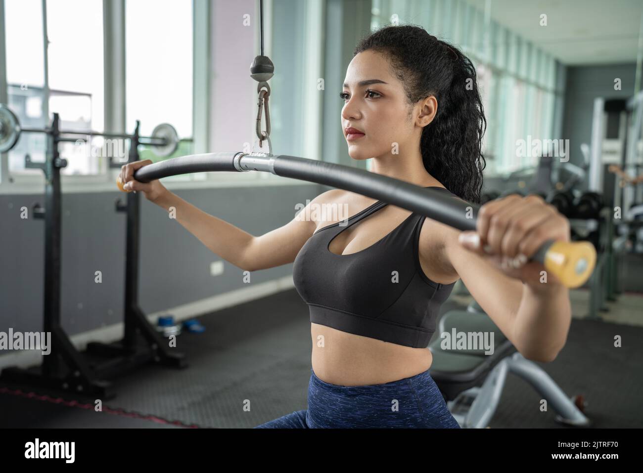 beautiful muscular fit woman exercising building muscles. Muscular