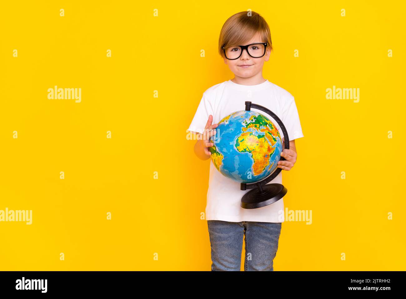 Intellectual Hand Some Portrait of handsome cheery intellectual pre-teen boy holding globe ...