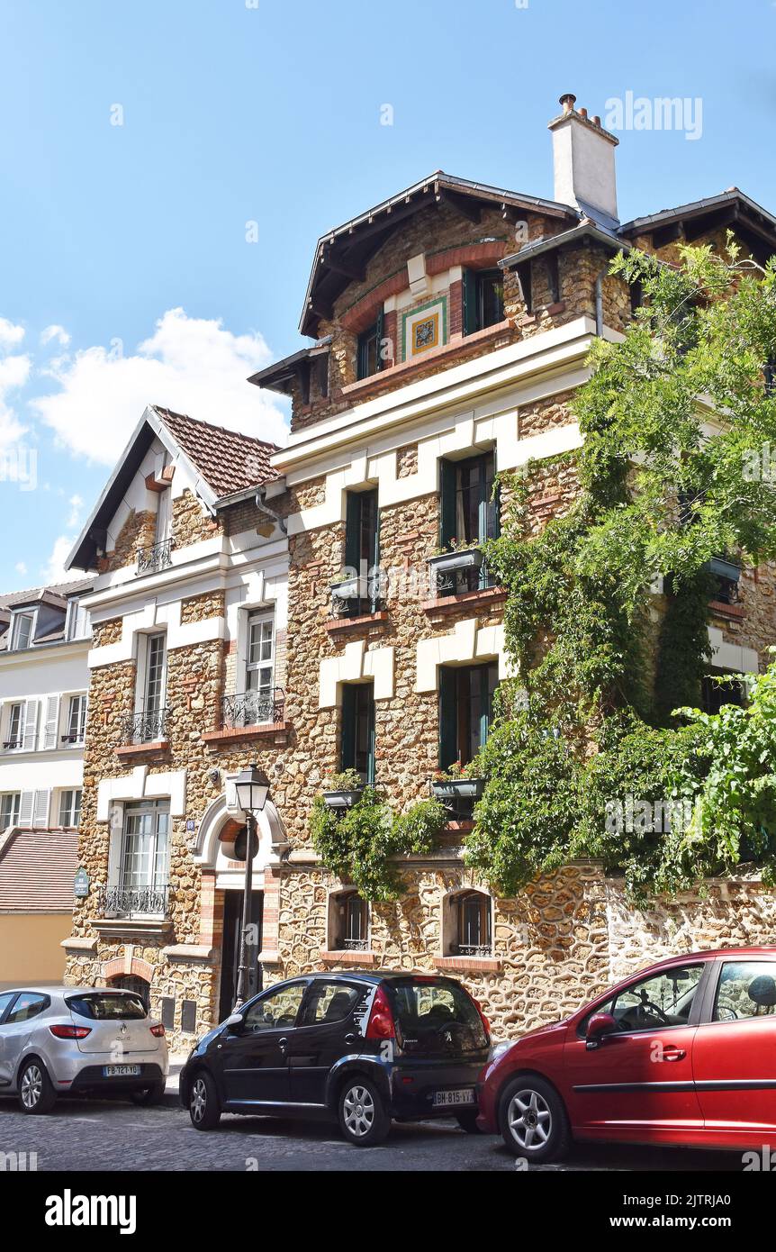 House, or houses, r. Ravignon, Paris, of red-brown rough stone, with ...