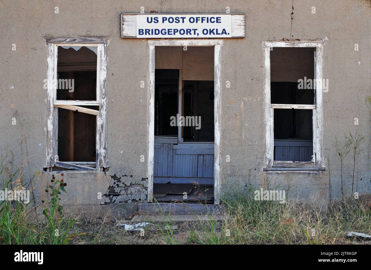 The abandoned post office building in Bridgeport, OK. The former Route 66 town was bypassed in 1934 when the historic road was realigned further south. Stock Photo