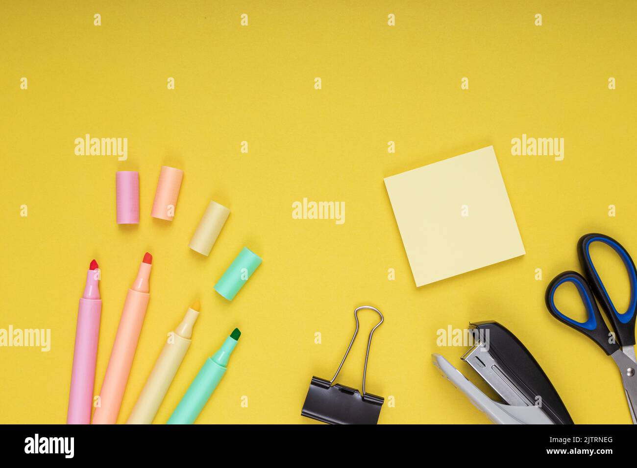 Colored pencils, clips and note paper, scissors, staple. back to school