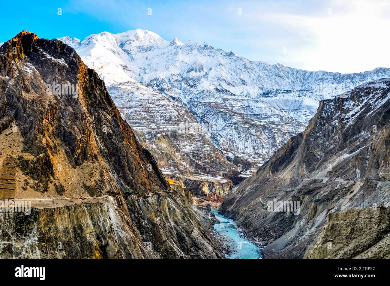 Karakoram highway well know as kkh or silk route along with the Indus river connects to  Pakistan and China is highest paved road in the world Stock Photo