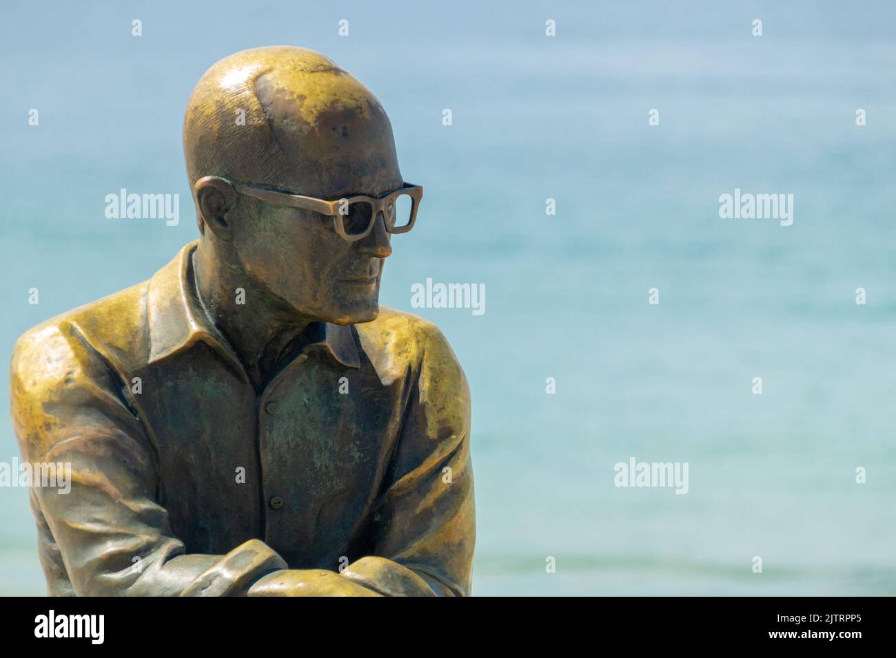 Statue of the poet Carlos Drummond de Andrade in Rio de Janeiro, Brazil - April 19, 2020: Statue of the poet Carlos Drummond de Andrade at Copacabana Stock Photo