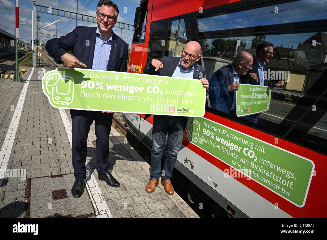 Aulendorf, Germany. 01st Sep, 2022. Winfried Hermann (Bündnis 90/Die Grünen, r), Minister of Transport for Baden-Württemberg, and Thorsten Krenz, Group Representative for the State of Baden-Württemberg, stand next to the first regional train to be refueled with biofuel. By the end of 2023, 1.3 million liters of biofuel are to flow. Deutsche Bahn's first regional train to run on biofuel is Aulendorf and Oberschwaben. Credit: Felix Kästle/dpa/Alamy Live News Stock Photo