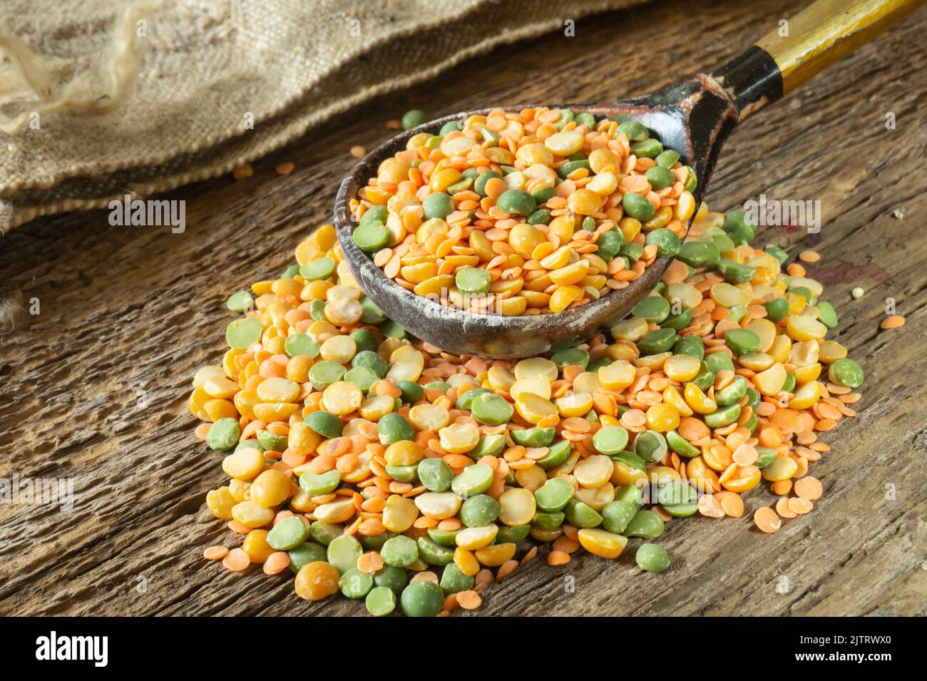 Grits from bright grains close-up. Food items on an old wooden board Stock Photo