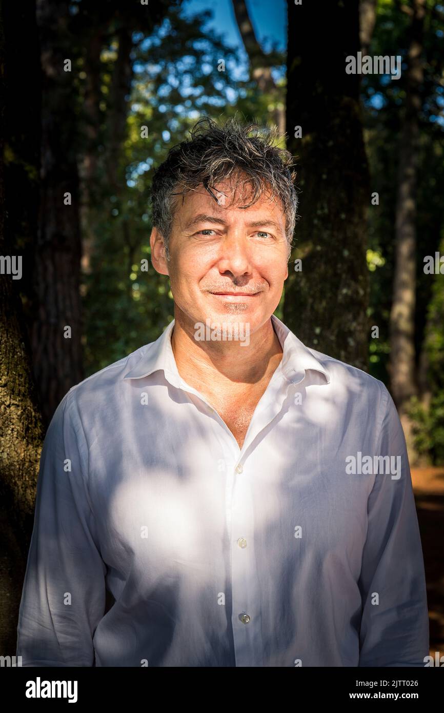 Man with blue shirt outdoors hi-res stock photography and images - Alamy