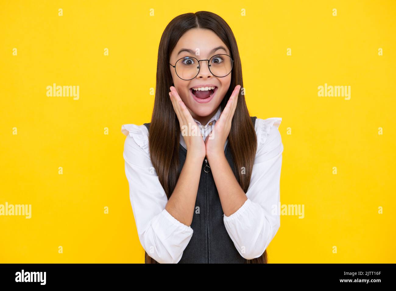 Excited kids face. Amazed expression, cheerful and glad. Amazed child with  open mouth on yellow background, surprise Stock Photo - Alamy