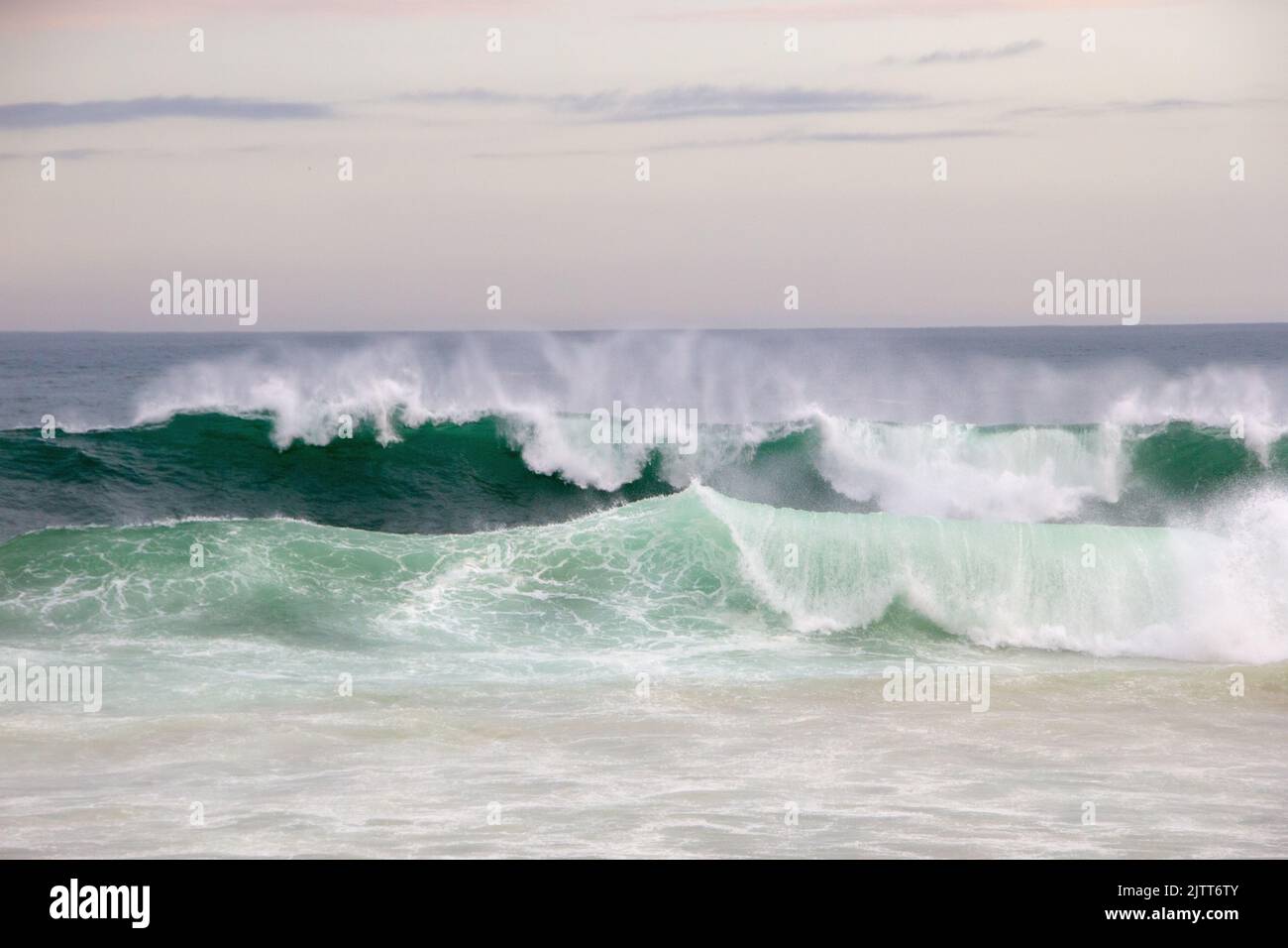lonely crashing waves in the late afternoon at leblon beach in Rio de Janeiro Brazil. Stock Photo