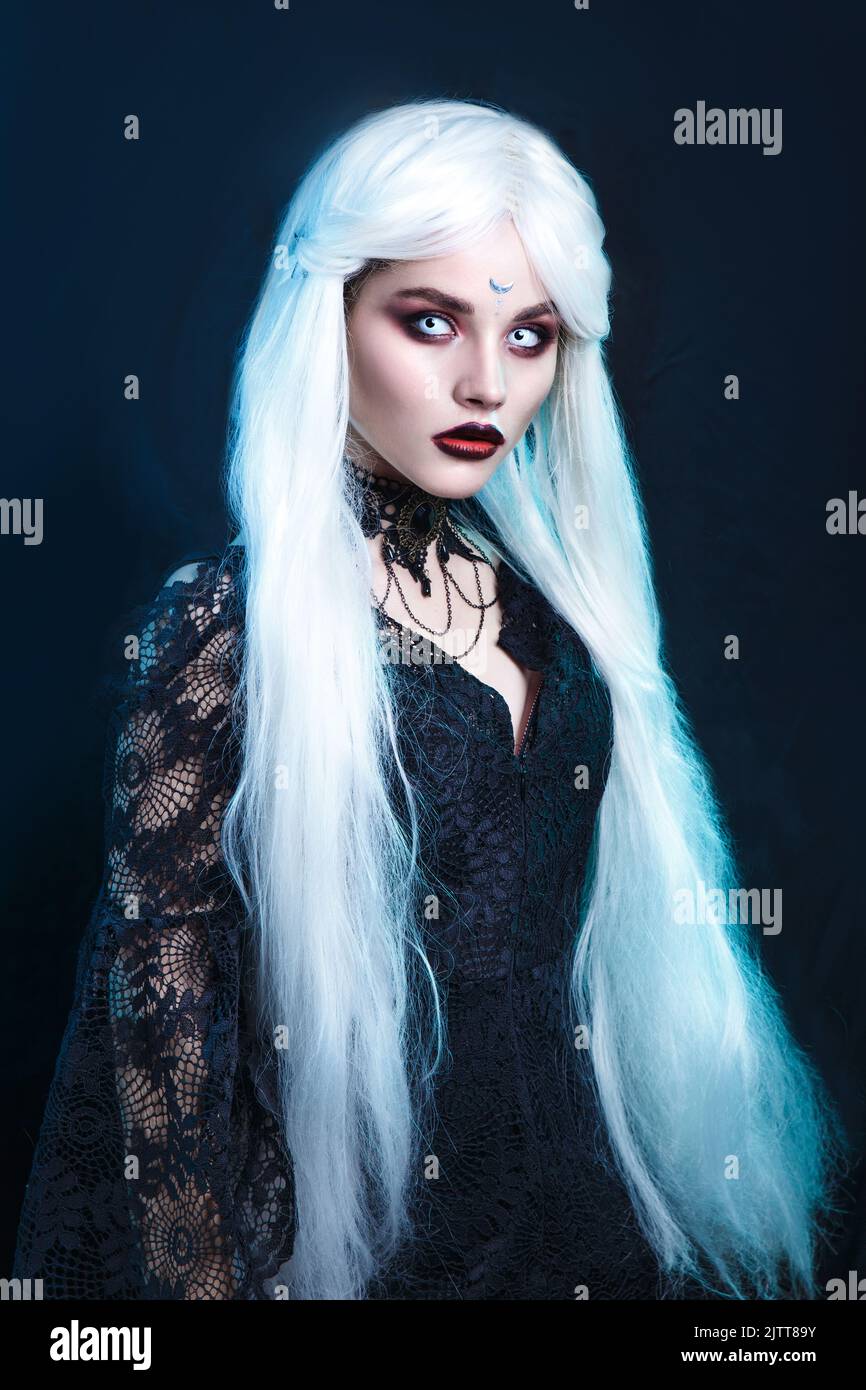 Woman vampire creative make up for halloween. Halloween Costume Party. Gothic halloween clothes. Stock Photo